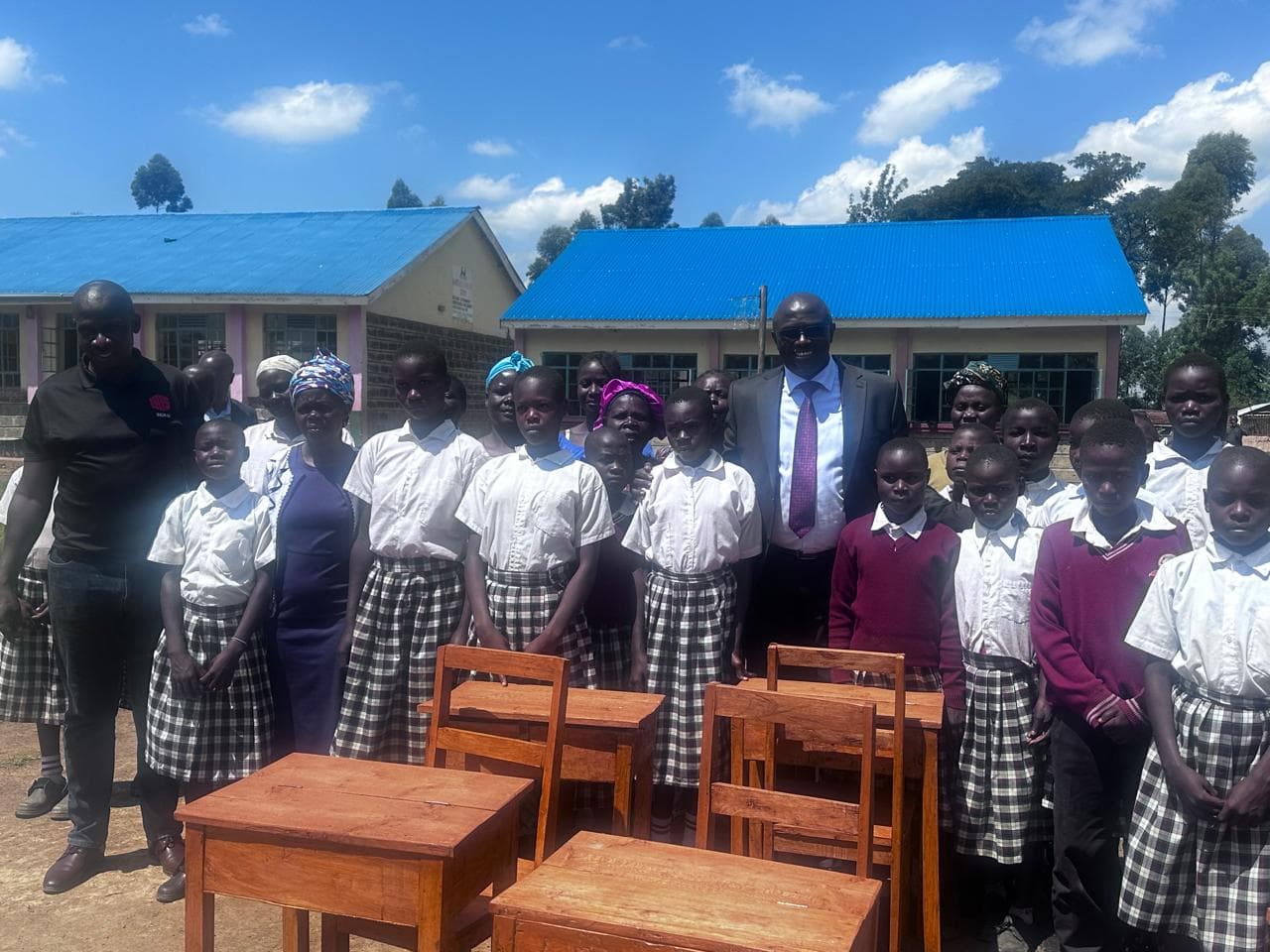 Tech innovator pledges full scholarships for 20 students as he makes donations to Webuye School