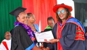 Kiambu Woman Representative Anne Wamuratha presenting a certificate of completion to a graduand during the Graduation Ceremony where 500 qualified with different skills. Photo Felix Wanderi