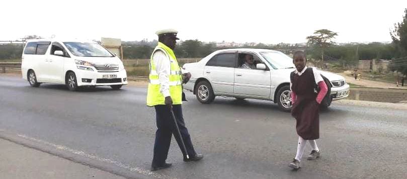 The volunteer who gets no penny to keep children safe on the road