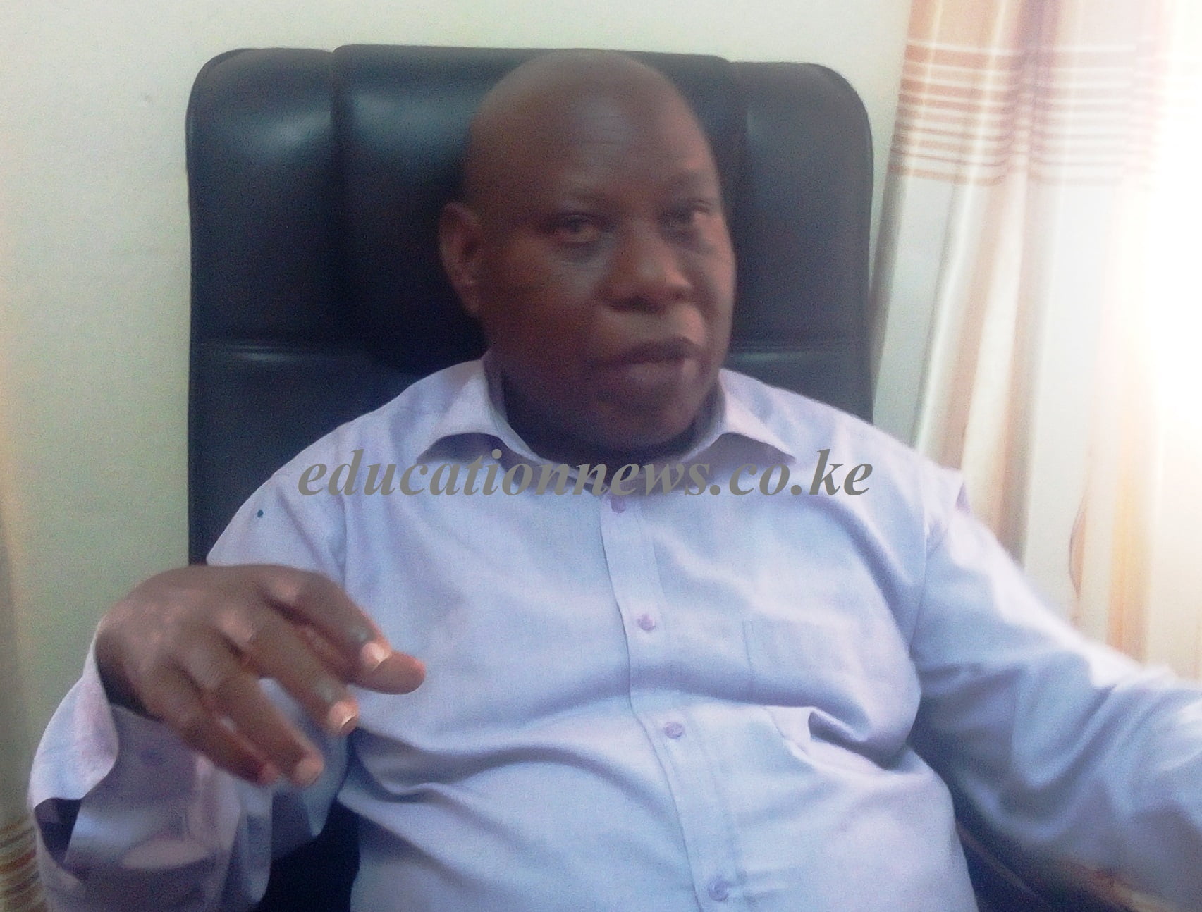 Makueni boys principal Raphael Diwani speaking in his office. Photo Lydia Ngoolo..