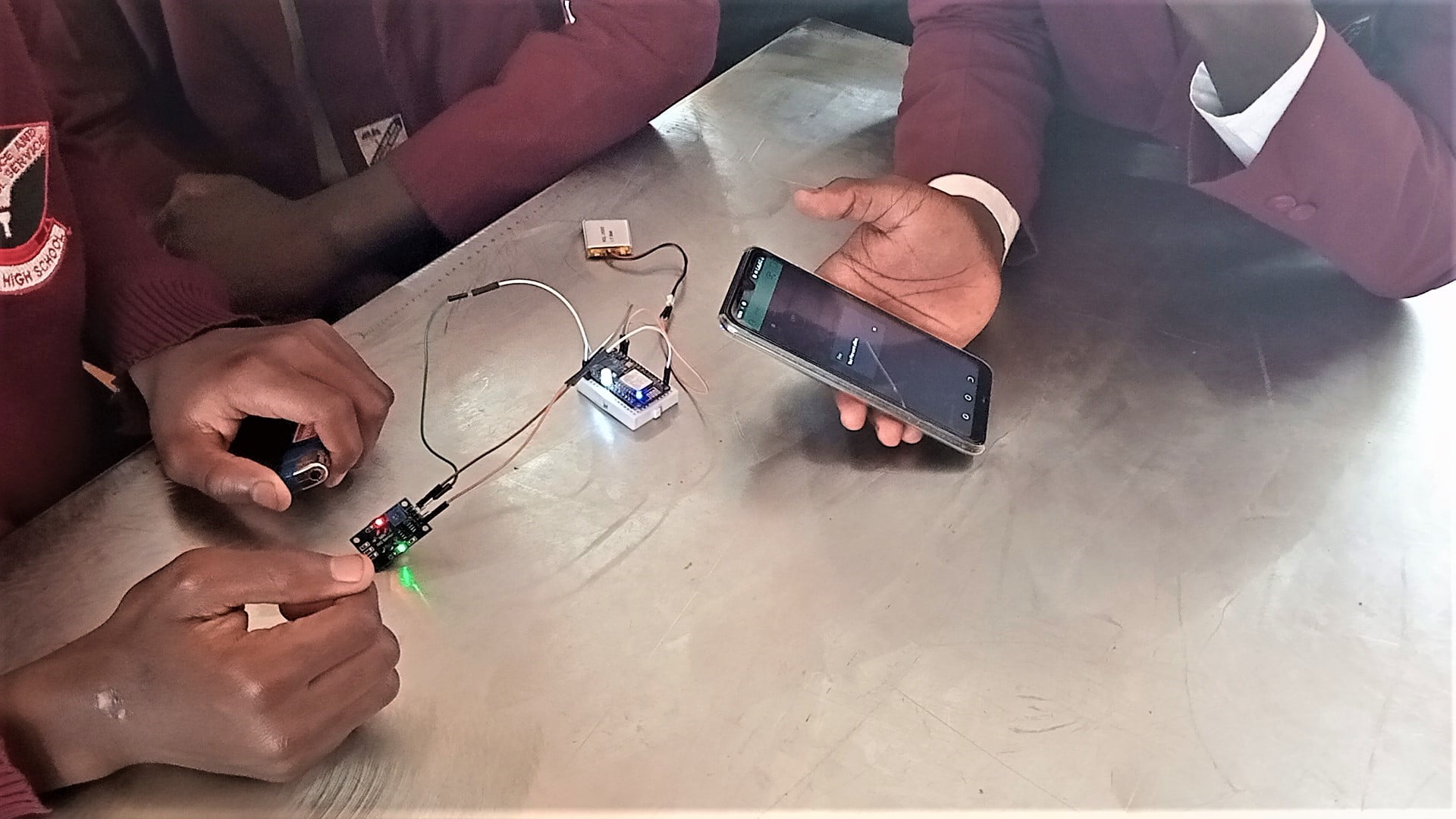 The students showcase how the security device operates.