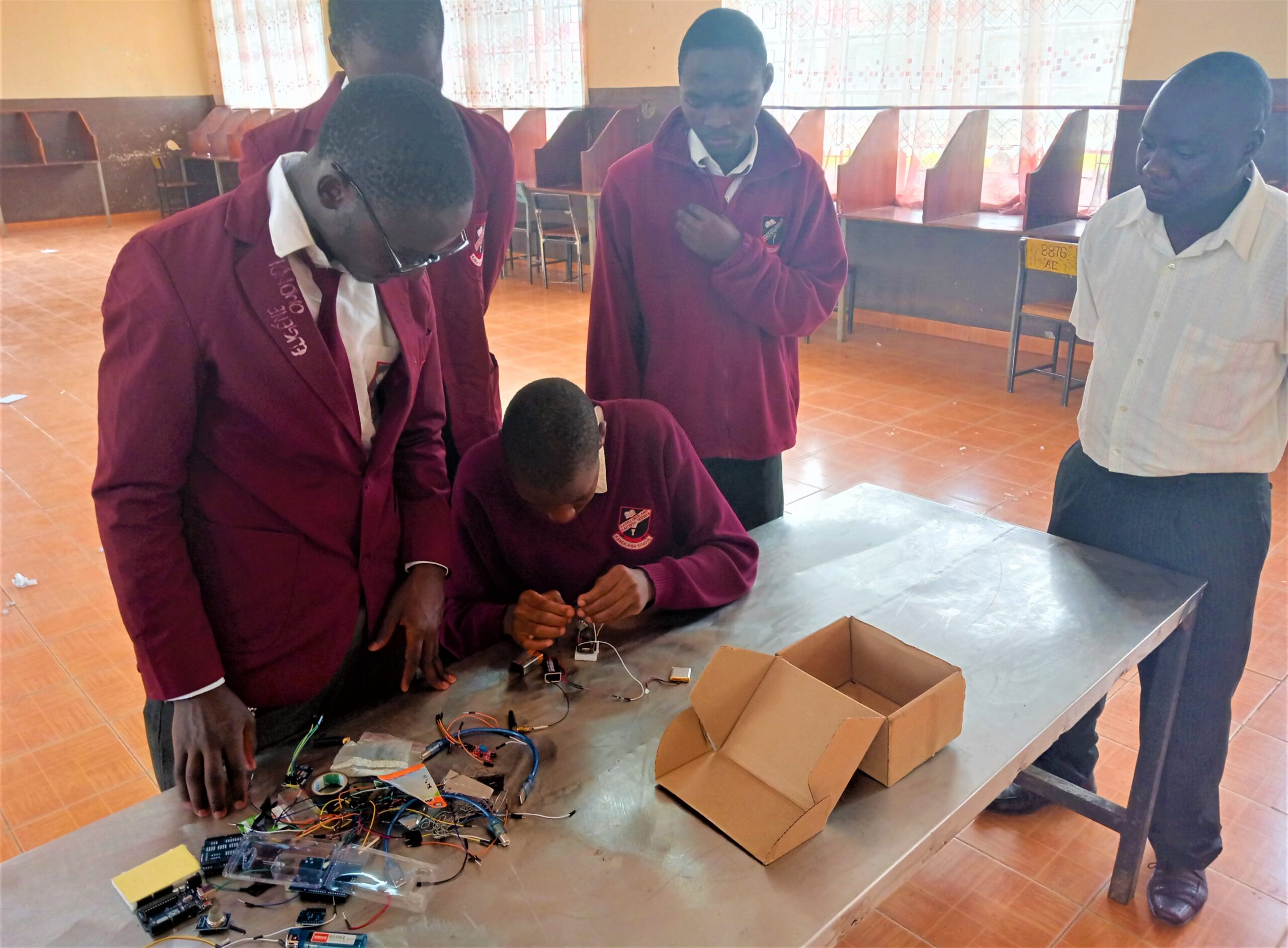 The students showcase how the security device operates.2 scaled