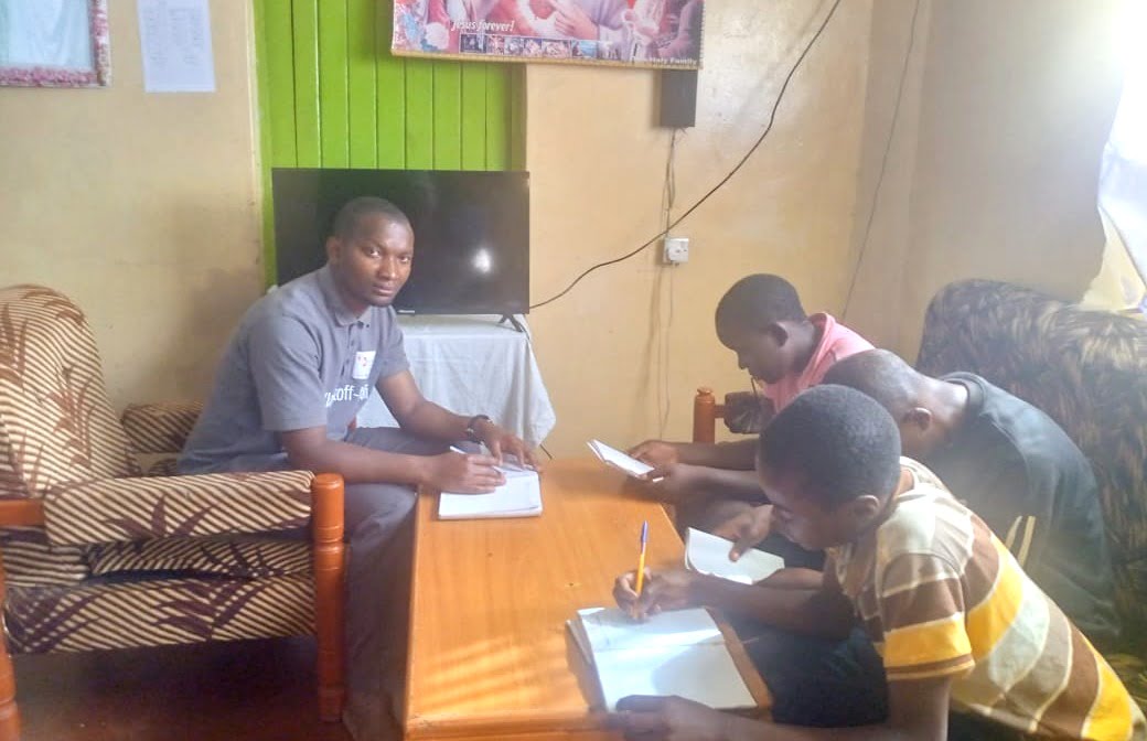Nyabaro with some of students in a tuition session