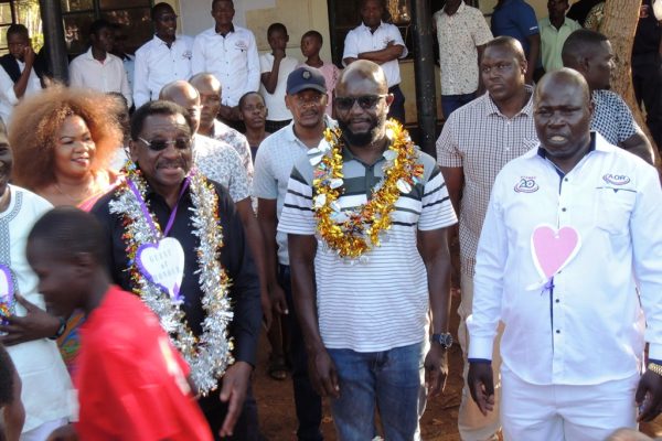Alego Usinga MP Samuel Atandi in the middle during a past function