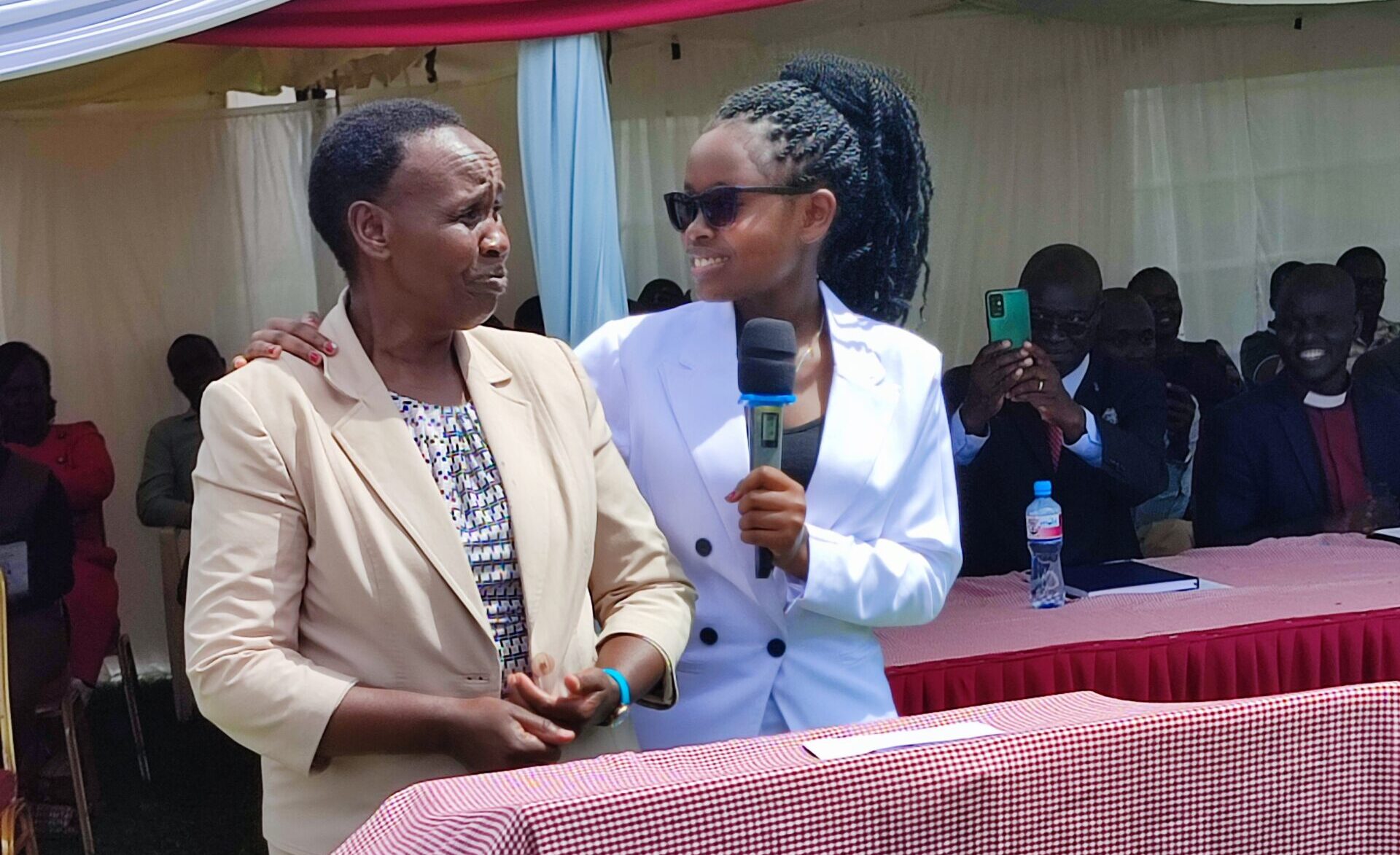 Kipsigis Girls Chief Principal Christine Chumba L together with KCSE 2021 top student Brenda Cherotich scaled e1697710522343