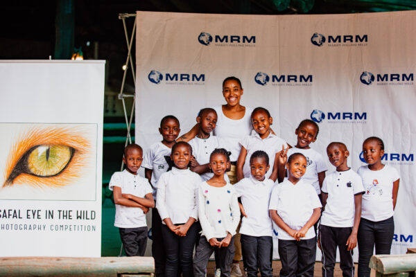 MRM official poses with the students