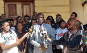 Danstan Omari speaks to the media at Milimani Law Courts. The courts rejected the petition to halt the Form