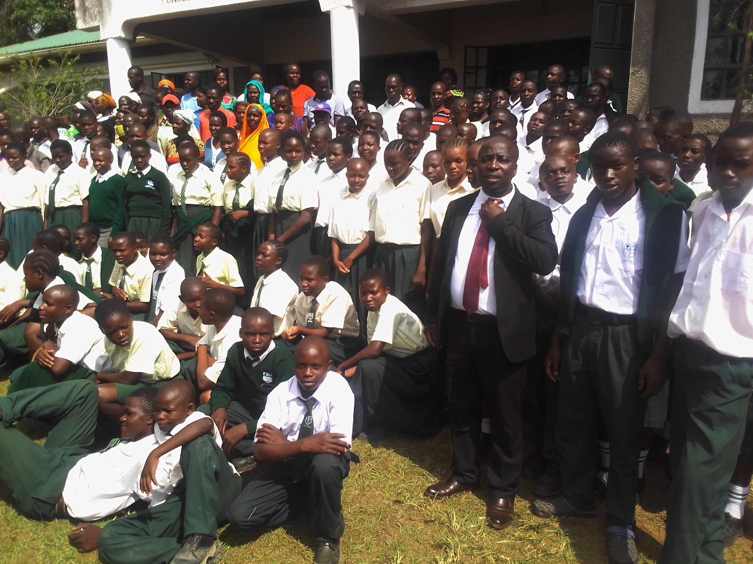 A step at a time for St Philip Ebwaliro as it inches forward gracefully 2 Form 1 parents teachers and students pose for a photo scaled