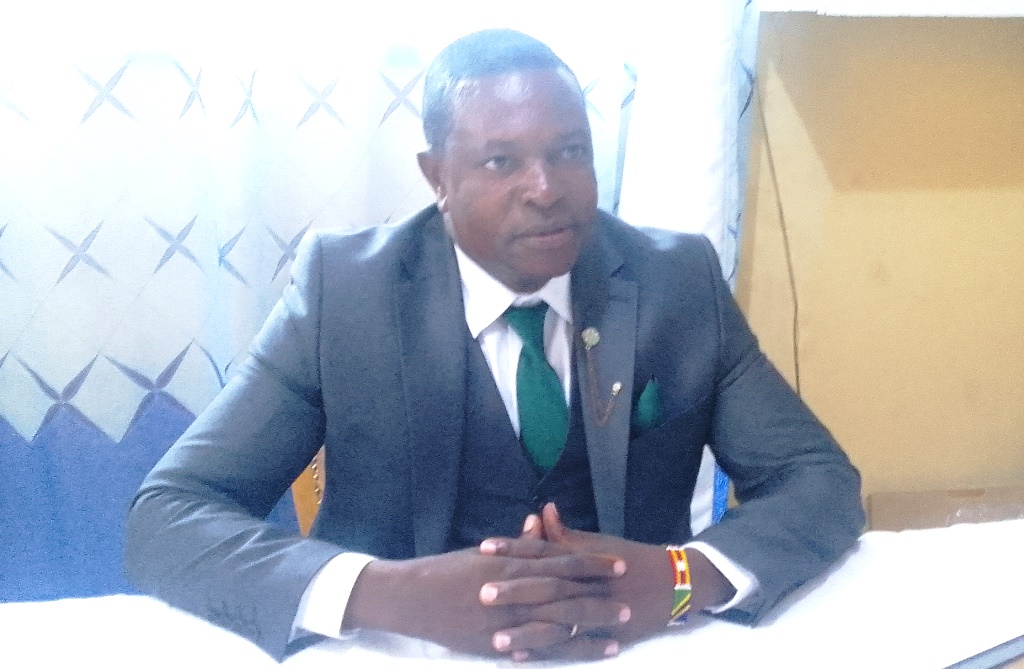 Govt asked to improve infrastructure in junior secondary schools 2 Mumias Central Primary School head teacher Francis Obwamu in his office