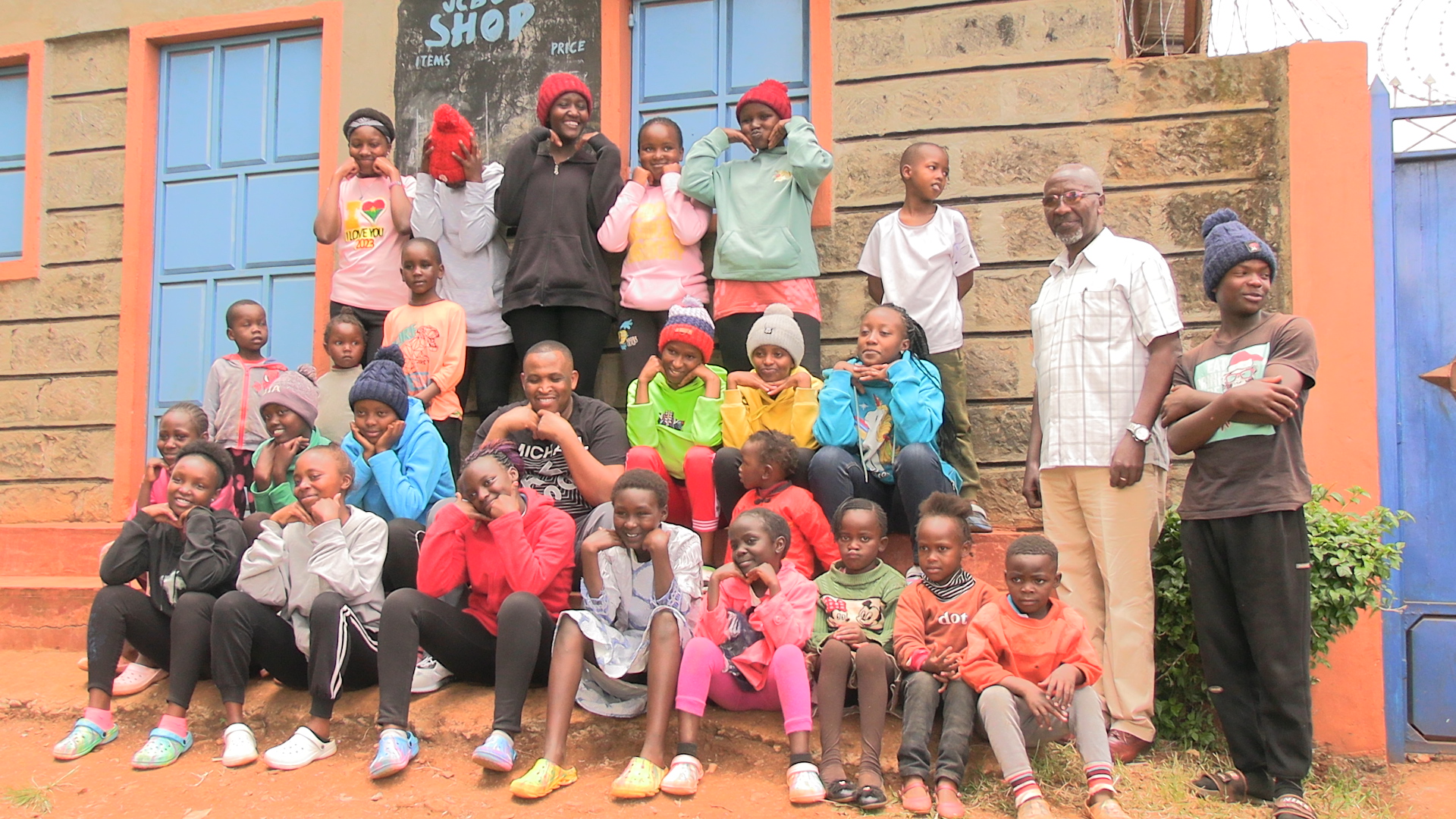 James Njoroge with some of the youngstars he supports through education