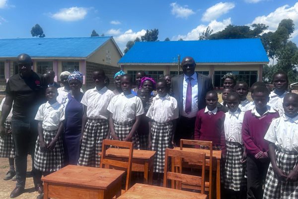 Tech innovator pledges full scholarships for 20 students as he makes donations to Webuye School