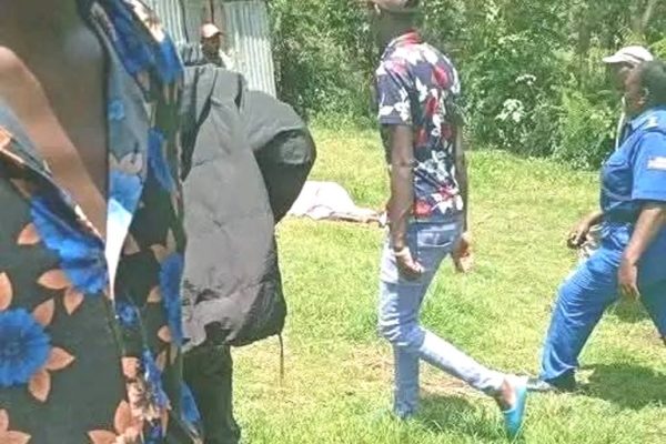 Villagers gather at the crime scene in Samutet Kericho where three family members were brutally killed