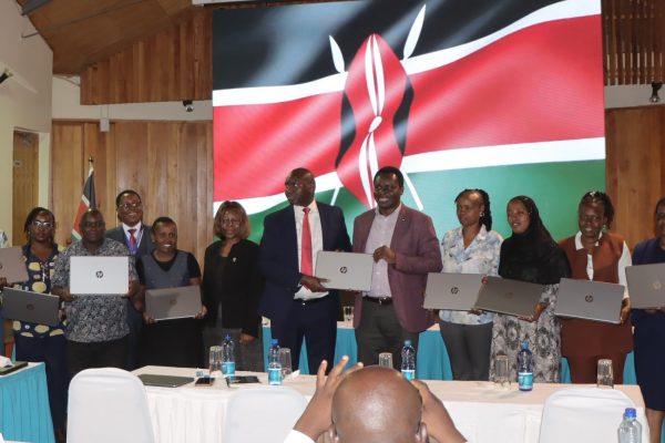 Basic Education PS Prof. Julius Bitok receives laptops donated by Intel Corporation to support digital technology in schools. Photo Obegi Malack