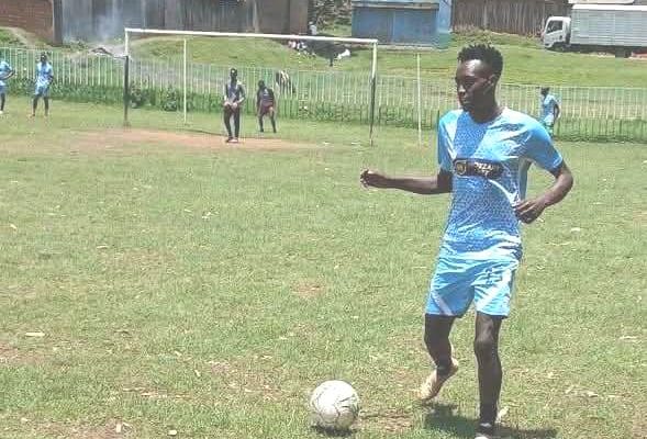 Green Snipers player in action against Bomet University College team during a friendly match Silibwet stadium