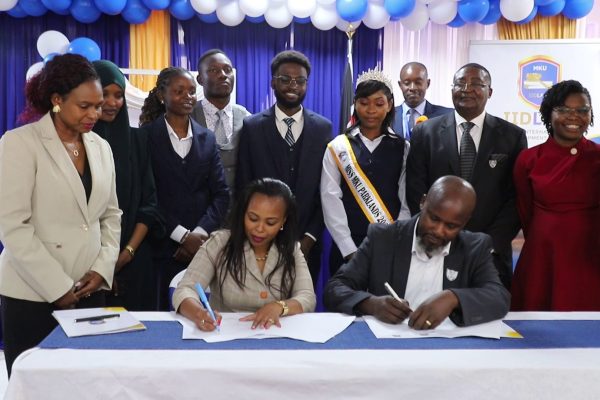 Judy Ngayu the Director of Institute of International and Development Law IIDLAW and Suluhu Mediation Center Director Maina Migwi sign pact to enhance mediation training in Nairobi. 1
