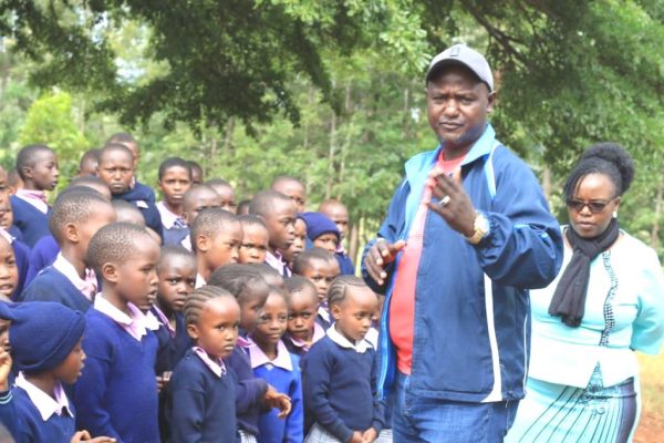 Kahumbu MCA Chefman Isaac Njoroge talks to the pupils of Mbogoini Comprehensive School during his motivational tour