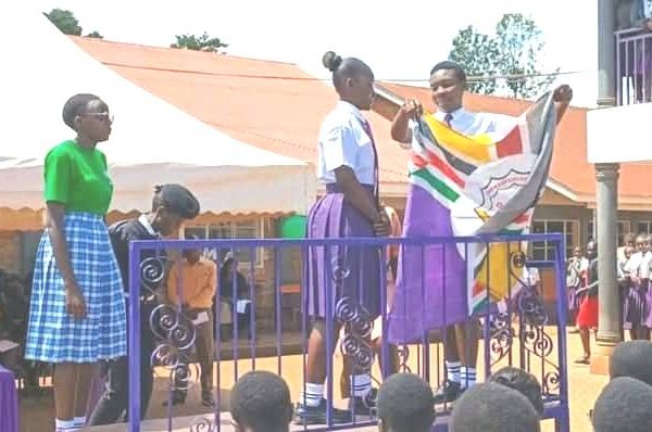 Outgoing captain Neema Lianda hands over to Neema Kemo at St. Josephs Girls Trans Nzoia showing a moment of grace and continuity