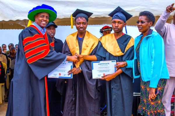 Kiambu MP Machua Waithaka celebrates with graduates of the Jitume ICT stage 1 program at Ndumberi ICT hub in kiambu