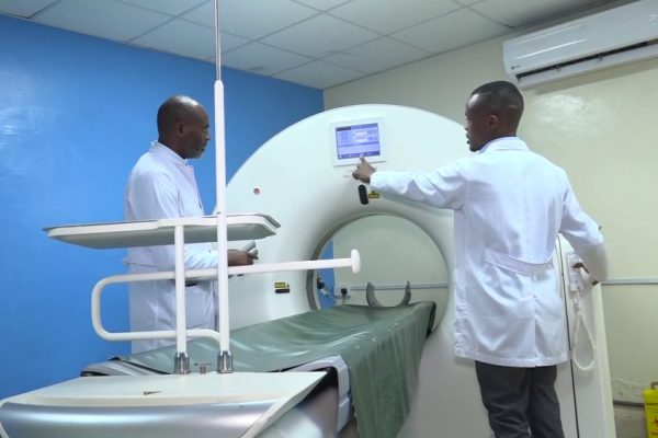 MIC imaging Center consultant radiologist Dr Daniel Somba inspects a CT Scan equipment at the facility. CT Scans are highly sought by accident victims