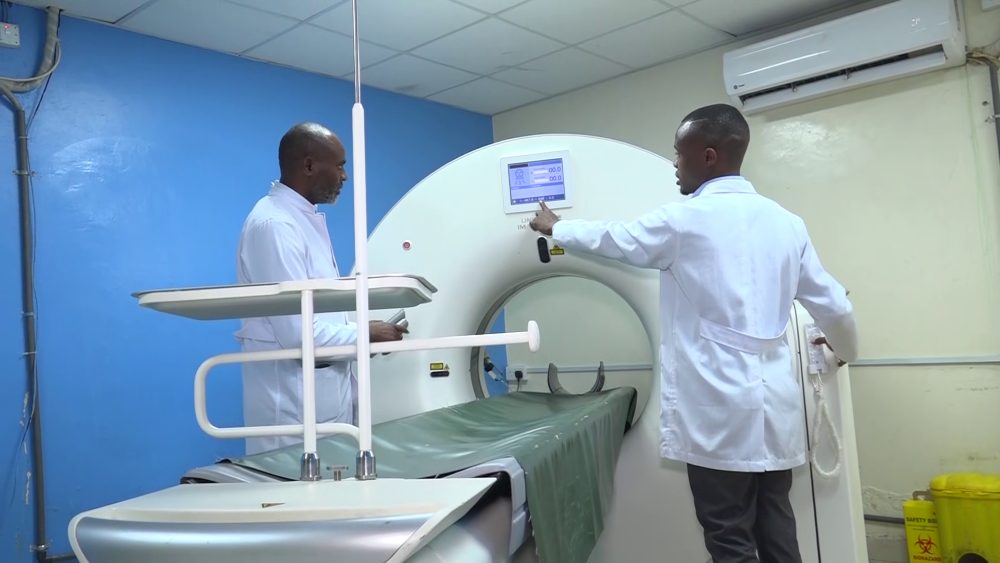 MIC imaging Center consultant radiologist Dr Daniel Somba inspects a CT Scan equipment at the facility. CT Scans are highly sought by accident victims