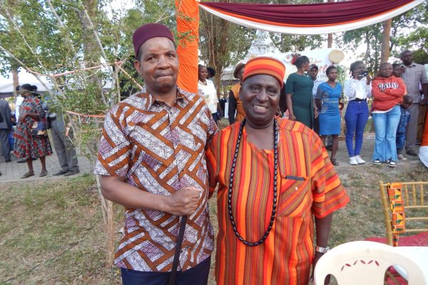Mr Kivutih poses for a photo with the new JNNP Principal Silvano Muriithi Nyaga