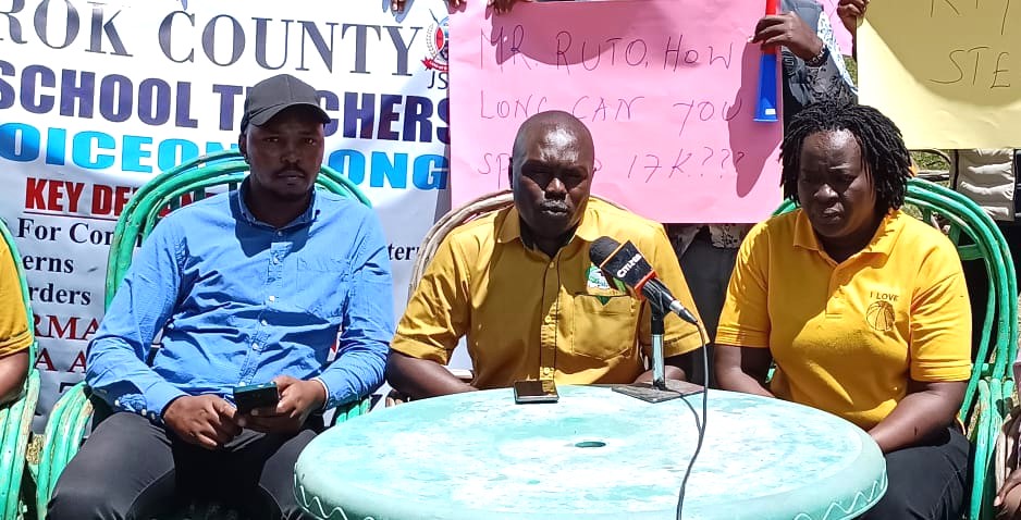 Narok KUPPET Branch Secretary Charles Ngenocentre and Treasurer Seela Kuluo right and JSS Intern chairman Abednego Singoe left during a press conference in Narok town