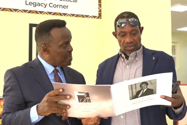 Veteran politician GG Kariukis son James Waigwa left and Joseph Njuguna a family member at Zetech University where the former MP was honored