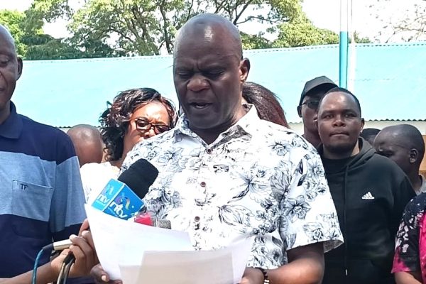 Bungoma D.E.B headteacher Tobias Khisa addressing the media