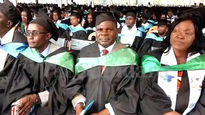 Cardinal Otunga Mosocho National School Principal Dr Ezekiel Okeyo middle savouring good moments after being awarded a PhD degree at Kisii University