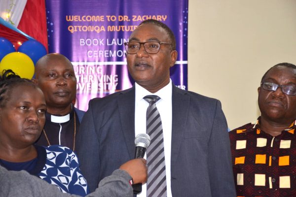Dr Zachary Gitonga Mutuiri speaking during the book launch