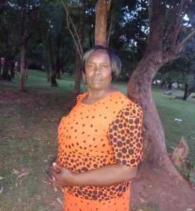 Woman in orange polka dot dress.