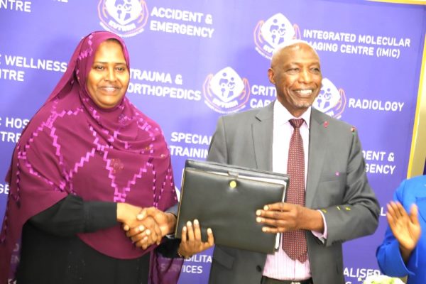 KU Vice Chancellor Prof Paul Wainaina and KUTRRH CEO Dr Zeinab Gura exchange signed MoU documents