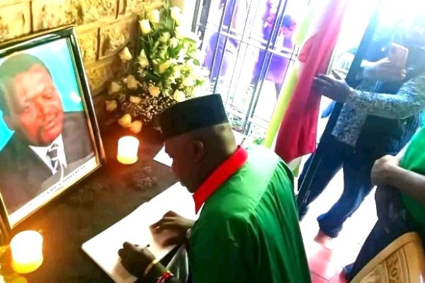 Knut second national vice chairperson Aggrey Namisi signing condolences book