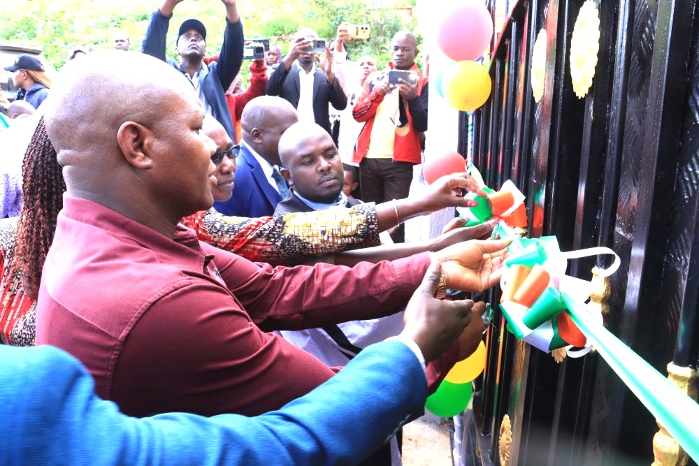 Machakos Deputy Governor Francis Mwangangi cuts ribbon to open a new gate at AIC Kariobangi in Machakos Town on Sunday December 212025