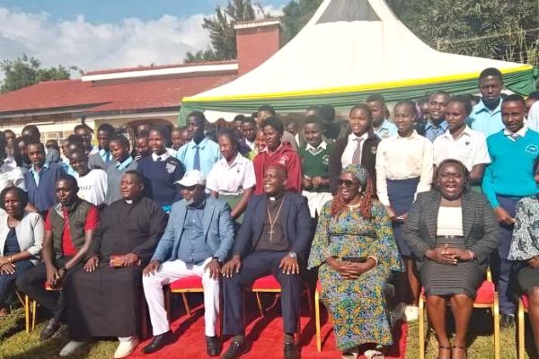 Meru Senator Kathuri Murungi in white trousers and hat during the Kamashinani Foundation mentorship programme at his office