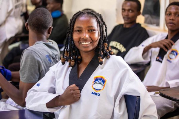 Mount Kenya University Taekwondo captain Emily Mweru enjoying her victory at the 10th KUSF national games
