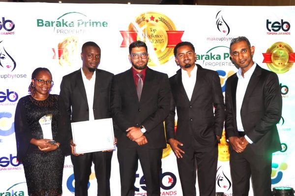 Precision Automotive CEO Imran Sokwala center with his team at the Topsin Brands awards in Nairobi on Monday. 1