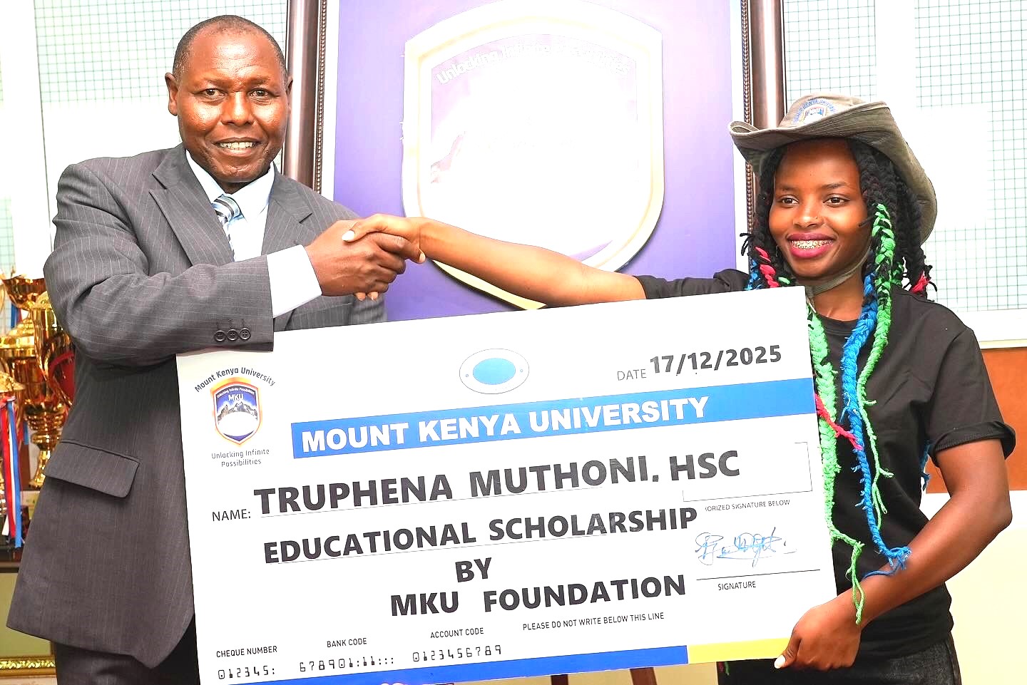 Nyeri girl who hugged a tree for 72 hours wins MKU scholarship 3 Prof Peter Wanderi MKU Principal Corporate Communications and Alumni Relations awards a full scholarship to environmentalist Truphena Muthoni at the university in Thika