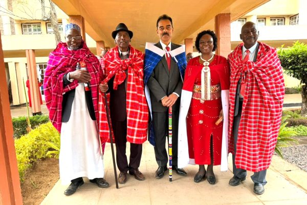 The Chancellor of Maasai Mara University Dr. Vimal Shah centre and the Vice Chancellor Prof. P. Aloo Obudhosecond right