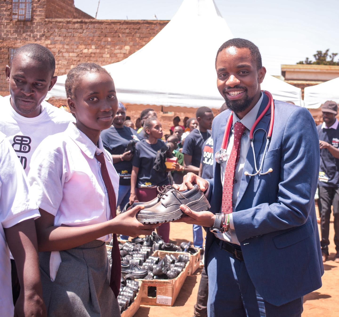 Boost for 1000 needy Juja pupils as well-wisher donates shoes 2 Dr Joseph Gichui a philanthropist and community leader in Juja participates in issuing shoes to needy learners at Gachororo primary school
