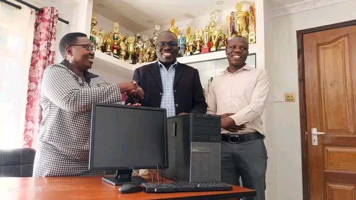 Kolanya girls senior school chief principal Dr.Tabitha Okama and Busia county CECM in charge of lands and housing Douglas Okiring .