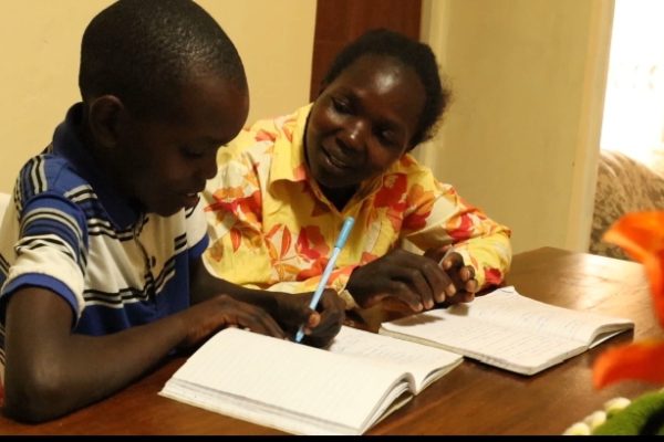 A CBE learner and parent during homework.