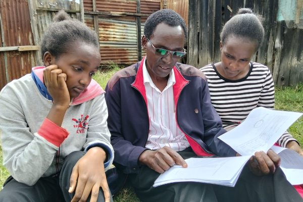 Twin sisters with their father