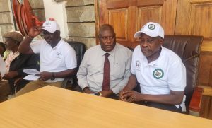 Borabu MP Patrick Osero (r) with other officials during the bursary disbursement