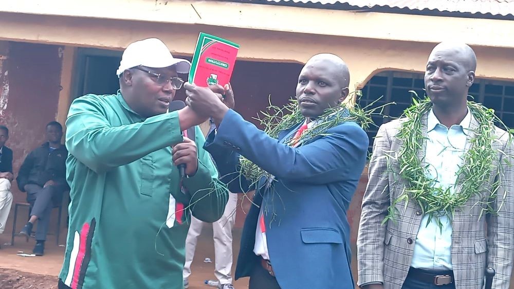 KNUT National Chairman Patrick Karinga left with newly elected KNUT Transmara Branch Chairman James Leparan centre and Executive Secretary Rodgers Limpaso