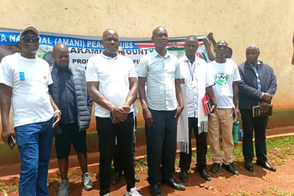 Kennedy Kunani stands alongside invited guests during the official opening ceremony of the 2026 Amani Clubs competitions in Kakamega County refined
