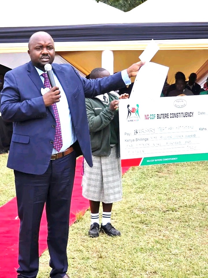 MP Tindi Mwale distributing Bursaries to students during the education support programme in Butere.