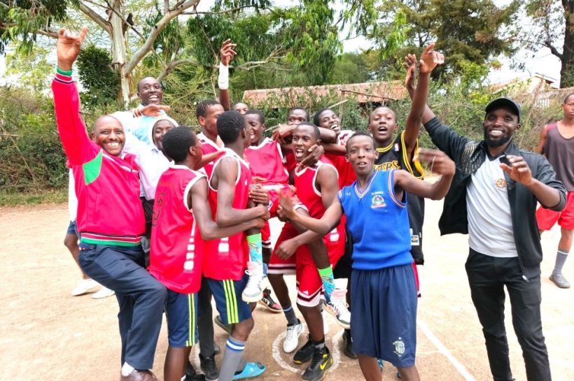 Oloomirani High School basketball players celebrate with their school principal Stephen Mutai and coach Nick Kirui refined