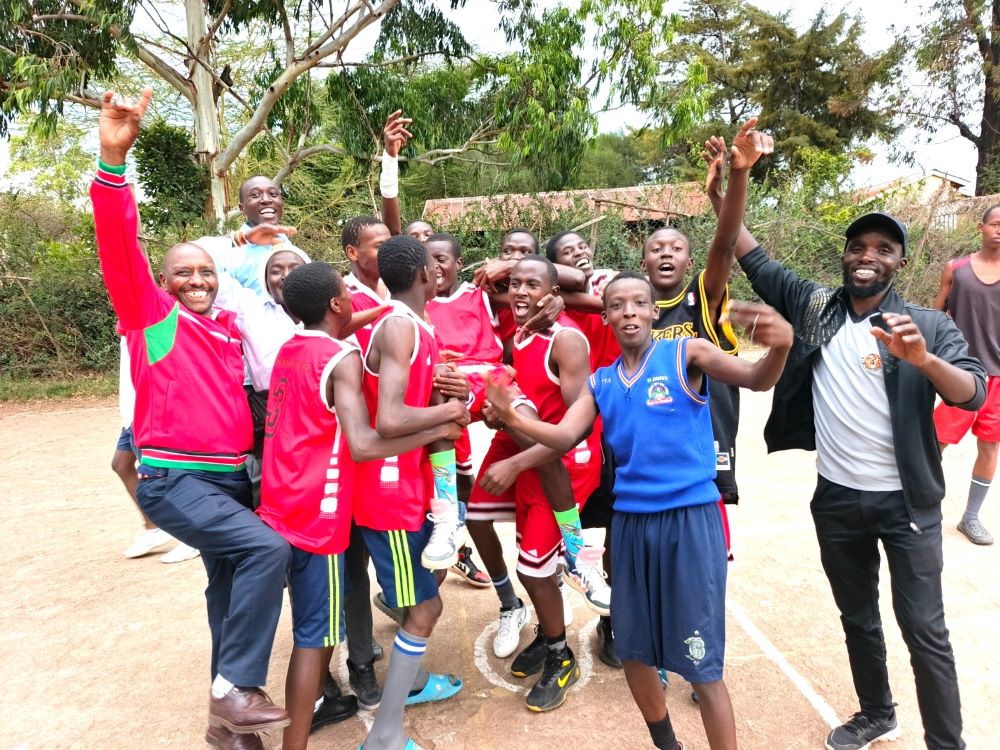Narok Amalo, Bomet East champions eye county glory after dominant sub-county performances 2 Oloomirani High School basketball players celebrate with their school principal Stephen Mutai and coach Nick Kirui refined