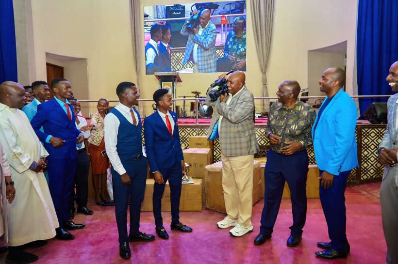 Prof Simon Gicharu hands over equipment to MKU's interdenominational students on Sunday.